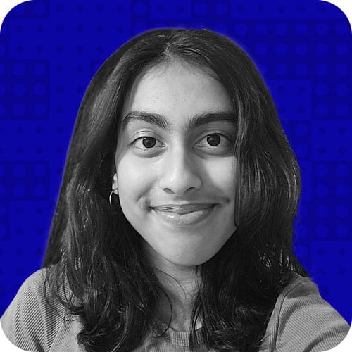 Young woman smiling at Ripple Foundation conference, promoting education and community engagement, in a professional setting focused on educational innovation and leadership.